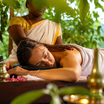 Luxury Ayurvedic massage and wellness experience at a peaceful Kerala resort