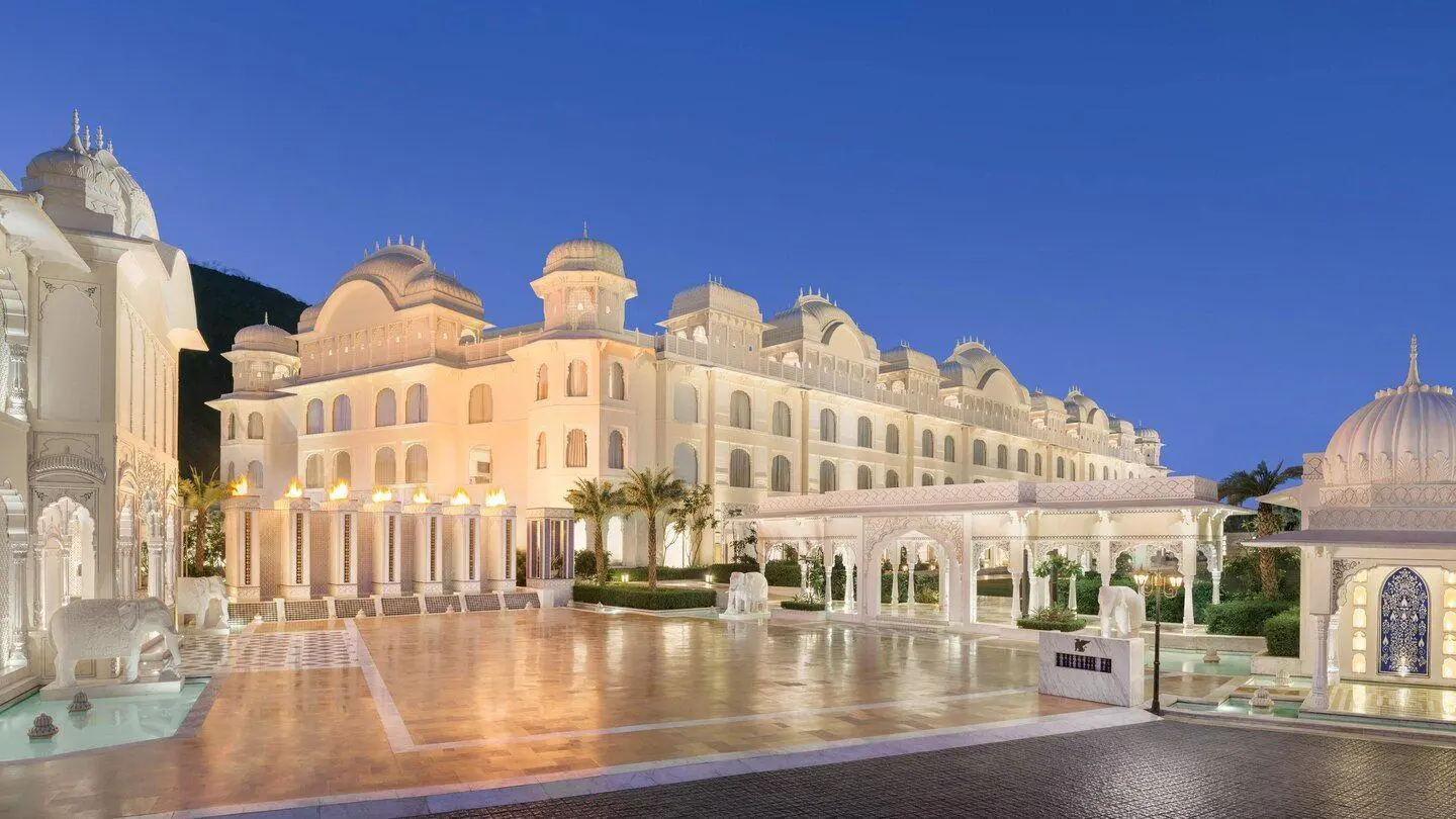 Luxury palace hotel in Rajasthan illuminated at dusk