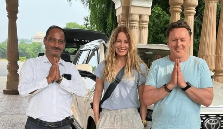 Private guide accompanying travellers at a heritage palace in India